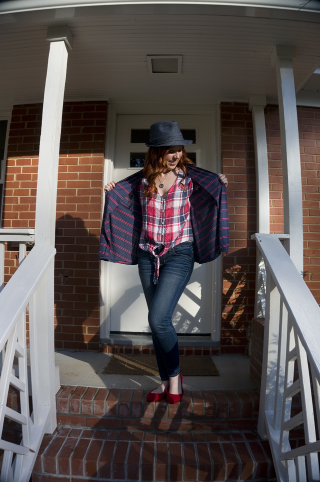 Caitlyn holds open the fronts of her cardigan to show how the grown-on facings hang on the inside