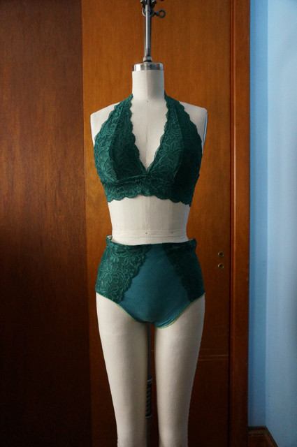 Front view of dress form displaying a lace halter bralette and high-waisted underwear with lace side panels